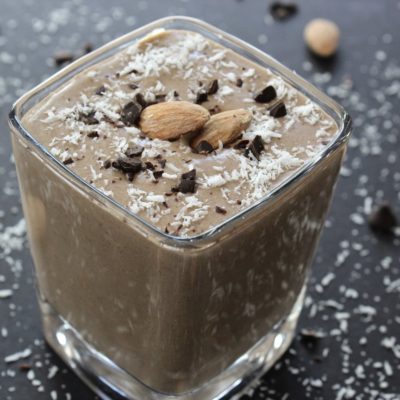 chocolate smoothie with cocoa, coconut and almonds on top