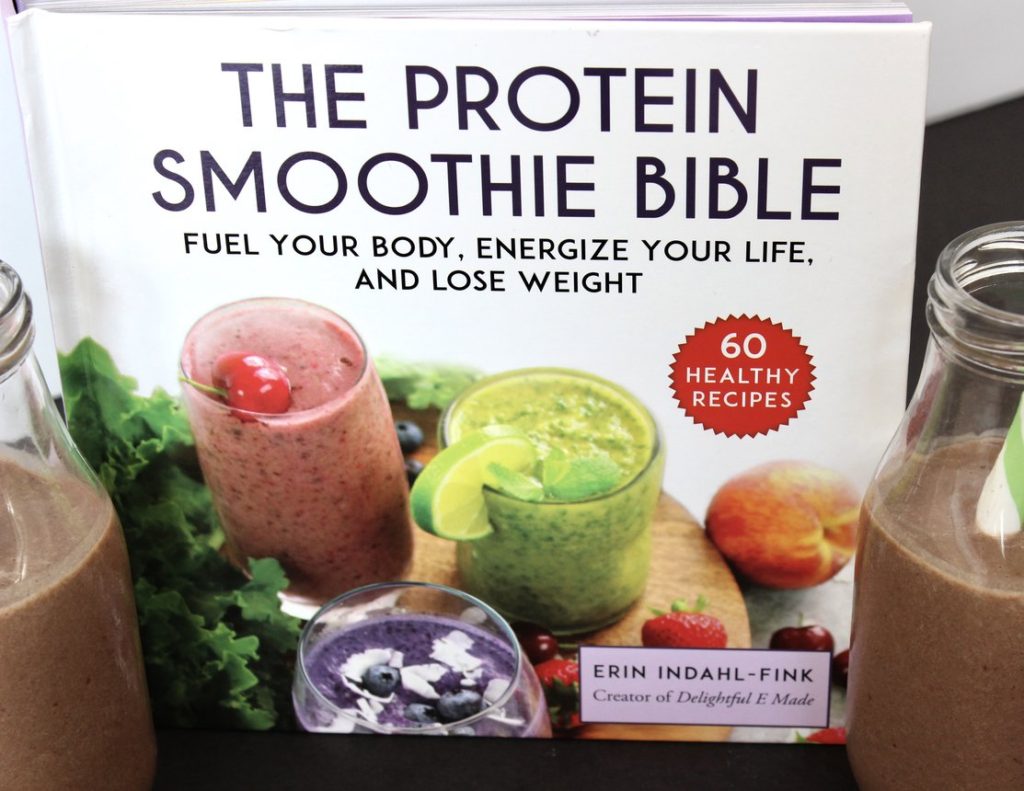 Picture of The Protein Smoothie Bible, with two smoothies around it.